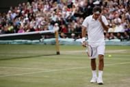 Roger Federer of Switzerland looks dejected during the men's singles Final match against Rafael Nadal of Spain on day thirteen of the Wimbledon Lawn Tennis Championships at the All England Lawn Tennis and Croquet Club on July 6, 2008 in London, England. (Photo by Lewis Whyld-Pool/Getty Images)